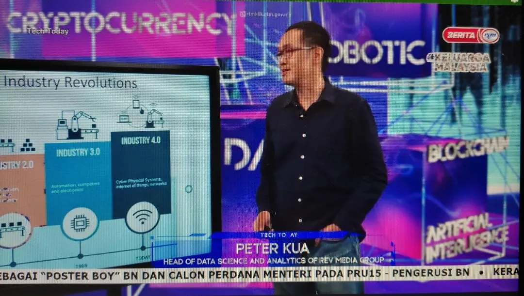 Peter Kua on the RTM Berita Tech Today studio set, with the broadcast caption naming him Head of Data Science and Analytics of REV Media Group.